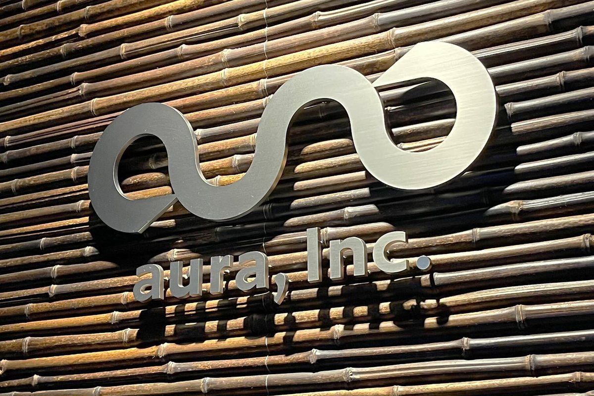Company logo on a bamboo wall