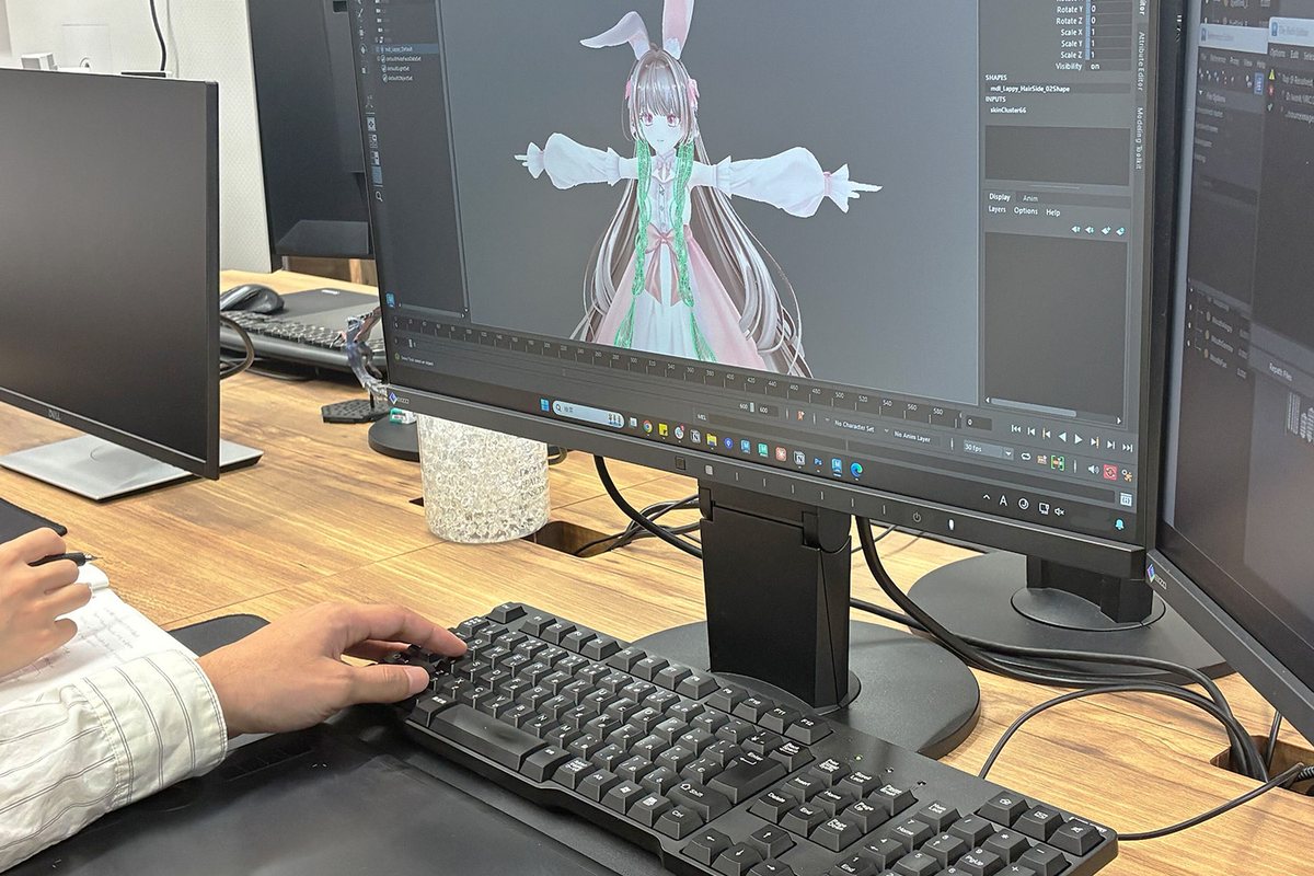 Hands of a staff member modeling in Maya